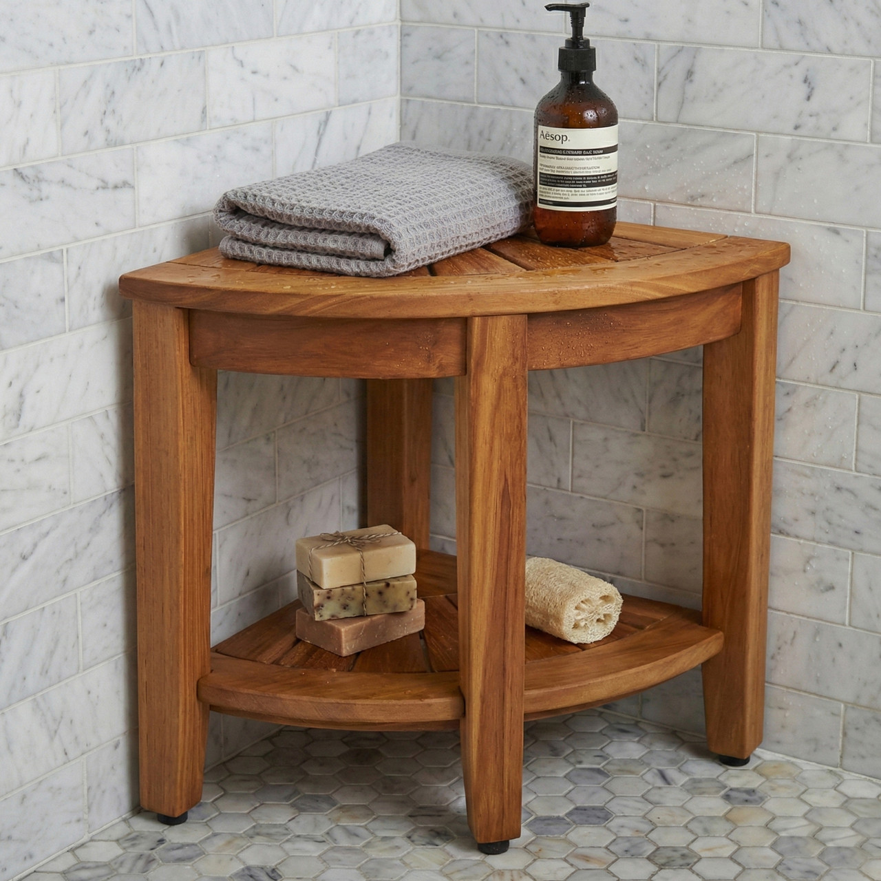 AquaTeak corner shower bench with towels, soap and a shelf