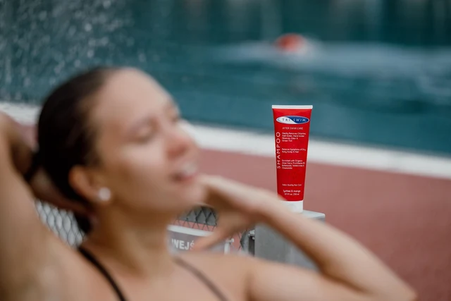 TRISWIM shampoo by a swimming pool
